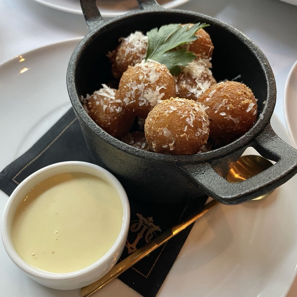 Turner's Cut - Crispy potato mochi ($15)-- no mochi texture, but tasty crispy potato balls with a creamy interior.  Garlic aioli sauce was flavorful - Cocktail Bars Near Me - Houston, Texas