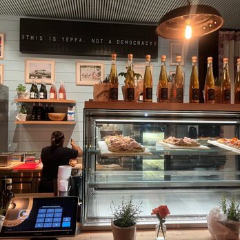 Yeppa & Co - a counter with a variety of food items - Cafes Near Me - Atlanta, Georgia
