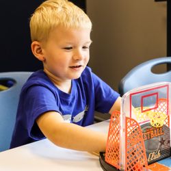 Enrichment Therapy and Learning Center - Therapy can look like play -- this mini basketball game builds skills while having fun.