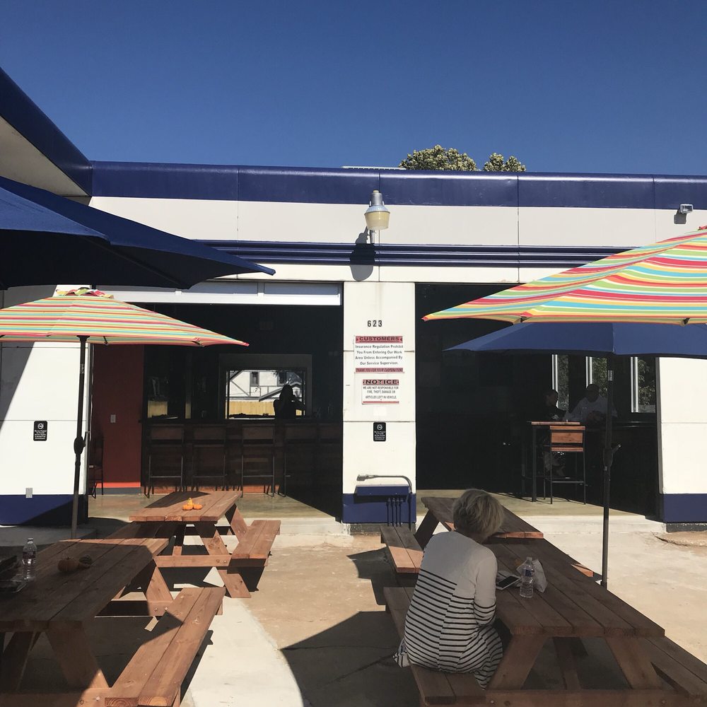 City Pump - Outdoor seating looking into garage - Food Trucks Near Me - Rogers, Arkansas