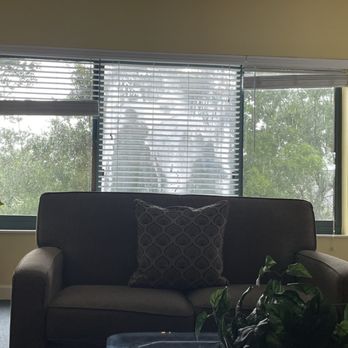 Waterside by Spinnaker Resorts - Broken window in unit, dusty artificial plants - dated carpet and furniture - Resorts Near Me - Hilton Head Island, South Carolina