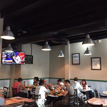 Wingstop - Small dining area. With three TVs! - Chicken Wings Near Me - Merced, California