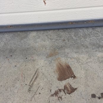 TAG Roofing & Solar - Spilled paint and dent in garage door - Roofing Near Me - San Diego, California TAG Roofing & Solar - Spilled paint and dent in garage door - Roofing Near Me - San Diego, California