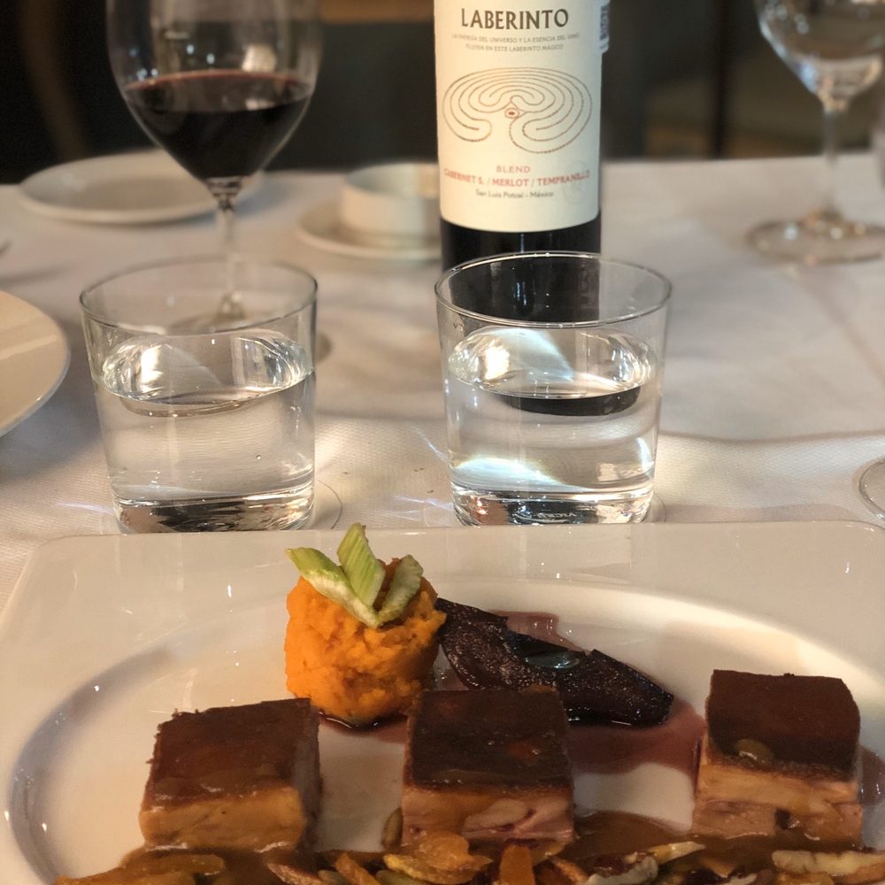Almara - Lechón perfectly paired with a delicious Mexican wine. - Mediterranean Near Me - Mexico, DIF Almara - Lechón perfectly paired with a delicious Mexican wine. - Mediterranean Near Me - Mexico, DIF