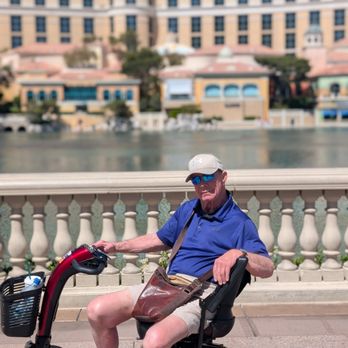 Scootaround Powered by WHILL - Me and my chariot in front of the Bellagio fountains. - Mobility Equipment Sales & Services Near Me - Las Vegas, Nevada Scootaround Powered by WHILL - Me and my chariot in front of the Bellagio fountains. - Mobility Equipment Sales & Services Near Me - Las Vegas, Nevada