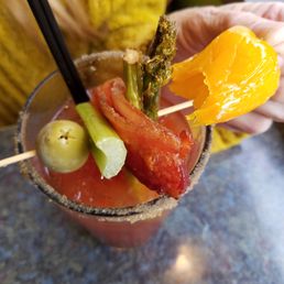 a person holding a bloody drink
