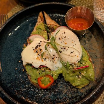 Toca Madera Las Vegas - Avocado toast with calibrian pepper sauce - Steakhouses Near Me - Las Vegas, Nevada Toca Madera Las Vegas - Avocado toast with calibrian pepper sauce - Steakhouses Near Me - Las Vegas, Nevada