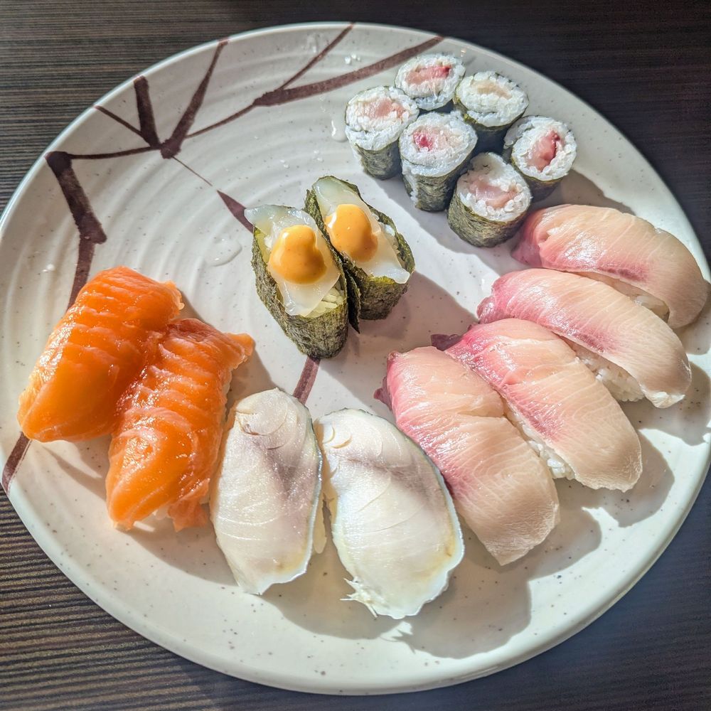 Daiki Sushi - Counterclockwise: salmon, mackerel, yellowtail, yellowtail and green onion roll. Center: scallop - Japanese Near Me - San Mateo, California Daiki Sushi - Counterclockwise: salmon, mackerel, yellowtail, yellowtail and green onion roll. Center: scallop - Japanese Near Me - San Mateo, California