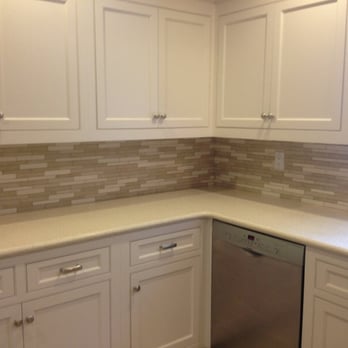 MT Tile - a kitchen with white cabinets and a dishwasher - General Contractors Near Me - Norwalk, Connecticut MT Tile - a kitchen with white cabinets and a dishwasher - General Contractors Near Me - Norwalk, Connecticut