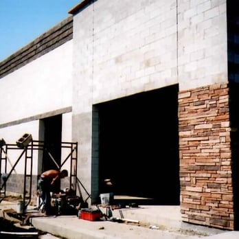 Byerly Masonry - a man working on the side of a building - General Contractors Near Me - Columbus, Ohio