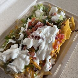 SUPER NACHOS (Queso+Meat + Toppings of your choice)