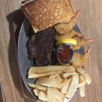 Steer N Stein - Steak and shrimp dinner, comes with two sides. I picked French fries and green salad. - Steakhouses Near Me - Hemet, California Steer N Stein - Steak and shrimp dinner, comes with two sides. I picked French fries and green salad. - Steakhouses Near Me - Hemet, California