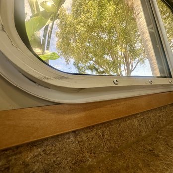 RV Glass Brothers - Installed window on top of wood trim - RV Repair Near Me RV Glass Brothers - Installed window on top of wood trim - RV Repair Near Me