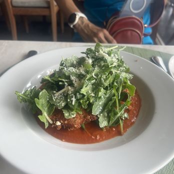 Mariposa - Chicken Milanese with. Couscous topped with Arugula Salad - New American Near Me - Honolulu, Hawaii Mariposa - Chicken Milanese with. Couscous topped with Arugula Salad - New American Near Me - Honolulu, Hawaii