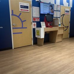 MinuteClinic at CVS - Clinic lobby... with a big red machine used in ancient times(apparently) to follow a schedule for appointments.