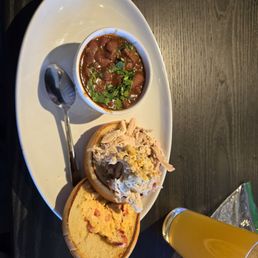 Chicken sandwich with chili and overpriced draft beer Chicken sandwich with chili and overpriced draft beer