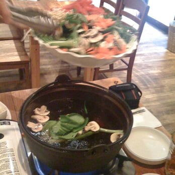 Oegadgib - Putting the Shabu Shabu ingredients into the boiling broth - Korean Near Me - Annandale, Virginia