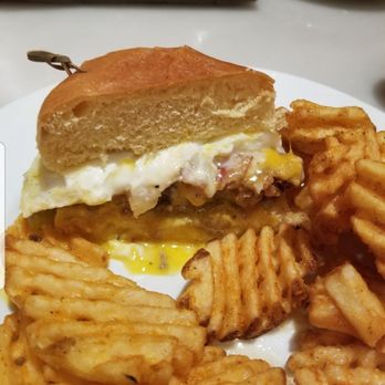 Café Milano - Country fried steak hamburger with a nice med runny egg in the center of the burger so delicious and silky smooth like cheese sauce. - American Near Me - Reno, Nevada Café Milano - Country fried steak hamburger with a nice med runny egg in the center of the burger so delicious and silky smooth like cheese sauce. - American Near Me - Reno, Nevada