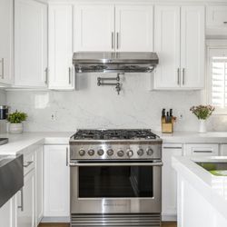 Reystone Construction - Kitchen remodel -- white shaker cabinets, stainless appliances, hardwood floors.