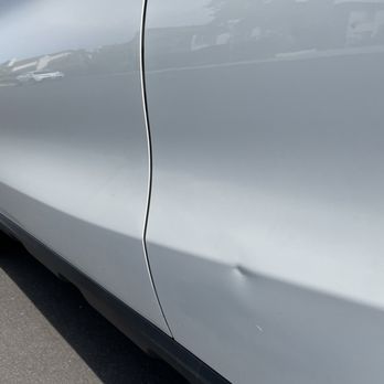 Fix-A-Dent Now  - Before: small sharp dent caused by another car's door - Mobile Dent Repair Near Me