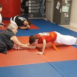 New Life Martial Arts - Brody doing his 50 push-ups to earn his tip