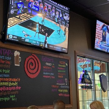 Grotto Pizza - Millsboro - people sitting at tables and watching tvs - Pizza Near Me - Millsboro, Delaware Grotto Pizza - Millsboro - people sitting at tables and watching tvs - Pizza Near Me - Millsboro, Delaware