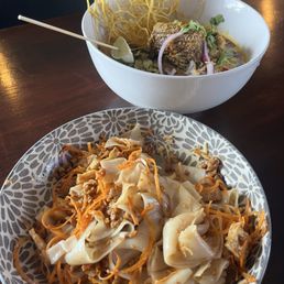 Sen Ya noodle in the front, Kao Sou noodle w/ short rib in the back Sen Ya noodle in the front, Kao Sou noodle w/ short rib in the back