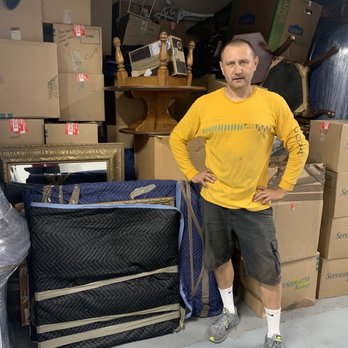 Viking Moving & Relocation Services - In front of the finished fully loaded storage unit. Nice work! - Movers Near Me