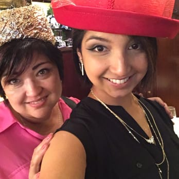 Olive Branch Cafe - Mom and daughter playing with the hat selection - Cafes Near Me - Tacoma, Washington Olive Branch Cafe - Mom and daughter playing with the hat selection - Cafes Near Me - Tacoma, Washington