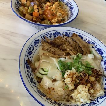 Changan Kitchen - N5 Hand ripped noodle with pork N9 triple combo noodle with pork, eggs, tomato, and carrots - Chinese Near Me - Ontario, California Changan Kitchen - N5 Hand ripped noodle with pork N9 triple combo noodle with pork, eggs, tomato, and carrots - Chinese Near Me - Ontario, California