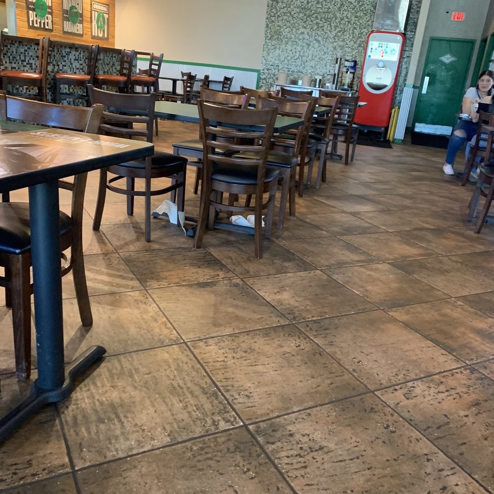 Wingstop - the inside of a restaurant with tables and chairs - Chicken Wings Near Me - Brownsville, Texas Wingstop - the inside of a restaurant with tables and chairs - Chicken Wings Near Me - Brownsville, Texas
