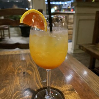 Poor Italian - a glass of orange juice on a table - Italian Near Me - Vancouver, British Columbia Poor Italian - a glass of orange juice on a table - Italian Near Me - Vancouver, British Columbia