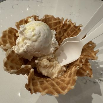 Jeni's Splendid Ice Creams - standard size with half scoop lemon bar and half scoop brown butter almond brittle in a waffle bowl - Desserts Near Me - Los Angeles, California Jeni's Splendid Ice Creams - standard size with half scoop lemon bar and half scoop brown butter almond brittle in a waffle bowl - Desserts Near Me - Los Angeles, California