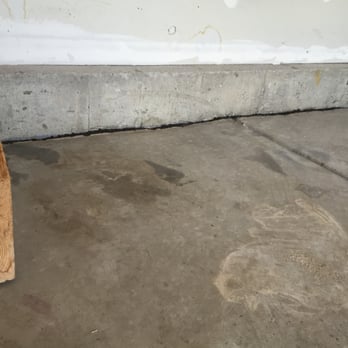 Liftech - After, stairs are solid as the day they were built, slabs returned to original grade level as indicated by old blue chalk line on wall. - Foundation Repair Near Me - Lakewood, Colorado Liftech - After, stairs are solid as the day they were built, slabs returned to original grade level as indicated by old blue chalk line on wall. - Foundation Repair Near Me - Lakewood, Colorado