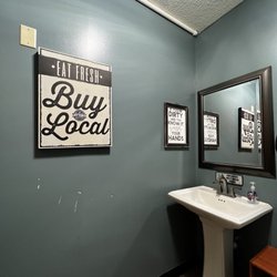 Jitters Coffee Bar - Gender neutral bathroom with fun signs
