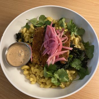 The Bark - Vegan mac & cheese bowl with tempeh bacon, chipotle crema, pickled onions, cilantro, and garlic kale - Vegan Near Me - Tallahassee, Florida