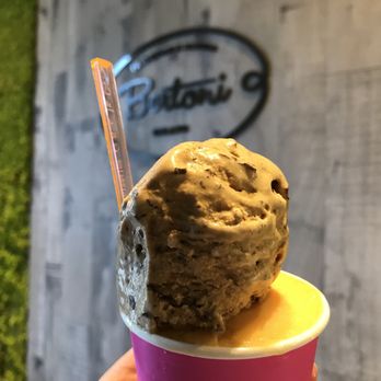 Bertoni - a hand holding a cup of ice cream - Ice Cream & Frozen Yogurt Near Me - Miami, Florida