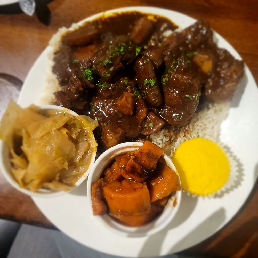 Brothers Restaurant And Bar - Oxtail with cabbage and yams - New American Near Me - Buffalo, New York Brothers Restaurant And Bar - Oxtail with cabbage and yams - New American Near Me - Buffalo, New York