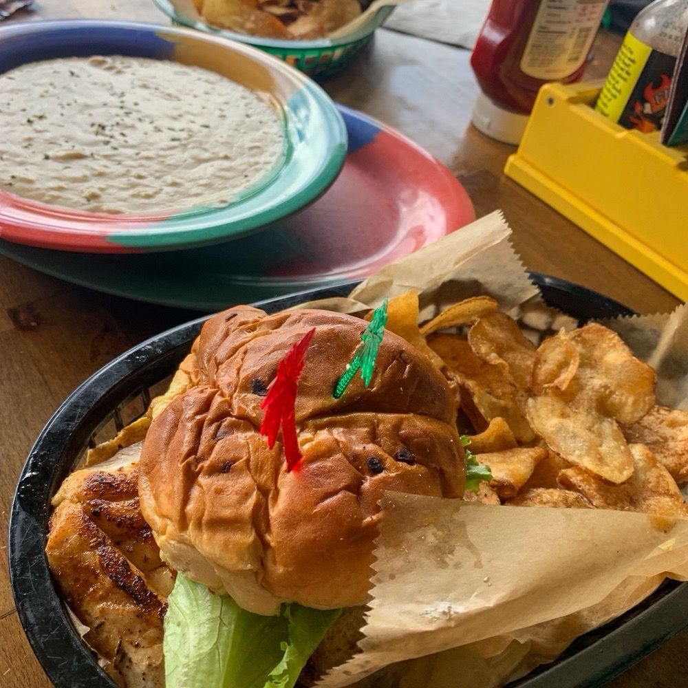 Huge fresh snapper sandwich, grilled with cajun jerk seasoning, with lettuce tomato Parmesan Romano, & tartar on soft fresh onion roll Huge fresh snapper sandwich, grilled with cajun jerk seasoning, with lettuce tomato Parmesan Romano, & tartar on soft fresh onion roll