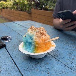 a bowl of ice cream and a cell phone a bowl of ice cream and a cell phone