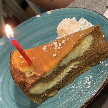 Blue Crab Restaurant - Caramel Cheesecake (with Birthday Candle) - Seafood Near Me - West Point, Virginia