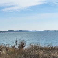 Chesapeake Bay Bridge Tunnel - View of the Chesapeke Bay Bridge drop the pristine sandy Beach at Kiprltopeke State Park.