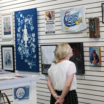 Blue Jacket Clothing - The 2nd Chance Art Exhibit wall in the store is artwork from the Non-profit's annual fundraiser pairing local artists with their clients. Al - Thrift Stores Near Me - Fort Wayne, Indiana