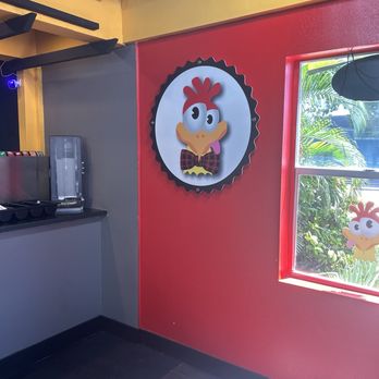 Mad Chicken - Interior- the chicken was everywhere - Chicken Wings Near Me - Pompano Beach, Florida