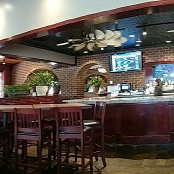 Cheddar's Scratch Kitchen - a woman sitting at the bar - American Near Me - Cookeville, Tennessee