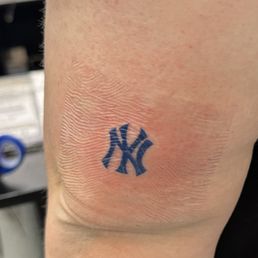 My tattoo done by Fifth, placed just above my elbow on the back of my arm.