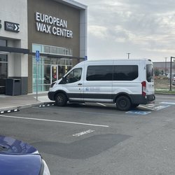Silver Lining Transport - Parked in a handicap spot no plates no placard and blocking the wheelchair ramp!