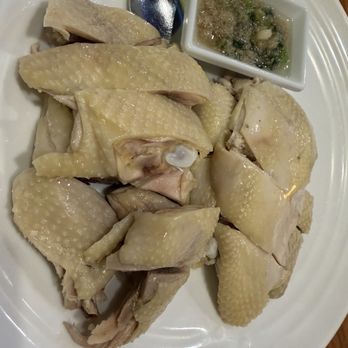 Cousin Cafe - Half of the hai nam chicken in cooked oil , ginger and green scallion sauce . - Chinese Near Me - Newark, California