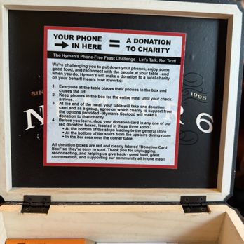 Hyman's Seafood - Box to hold phones if you do so they will contribute to a charity you choose on card - Seafood Near Me - Charleston, South Carolina Hyman's Seafood - Box to hold phones if you do so they will contribute to a charity you choose on card - Seafood Near Me - Charleston, South Carolina
