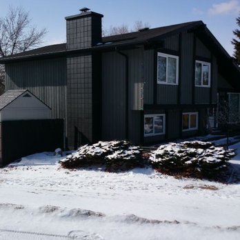 Finished Right Painting - After. Cedar siding, brick fireplace, and wood trim - Painters Near Me - Edmonton, Alberta Finished Right Painting - After. Cedar siding, brick fireplace, and wood trim - Painters Near Me - Edmonton, Alberta